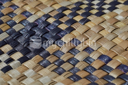 Maori weaving - closeup of takitahi weave with dyed and natural strands