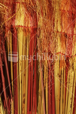 Yellow, red and orange flax fibres and pokinikini - Maori flax weaving