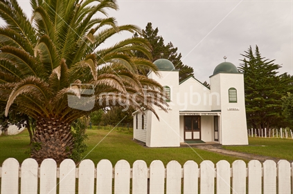 Ratana Church with palm tree and white fence, in Te Kao, Aupouri Peninsula, Far North, Northland