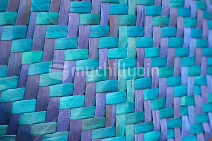 Closeup of Maori flax weaving with blue strands (whenu) of a kete