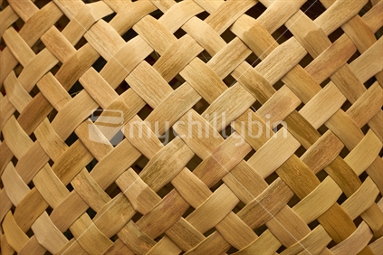 Flax weaving background: kete woven with Maori takitahi weave - rough with big natural strands