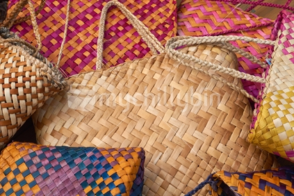 Maori flax kete - group of 7 bags with natural, yellow, brown, magenta, orange, red, purple and blue colours