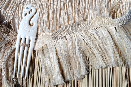 Maori Kahu Pokowhiwhi shoulder cloak made of white muka fibre and pokinikini