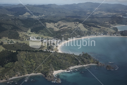 Aerial view from above of Oakura on the Northland east coast, coastal view with village and beach