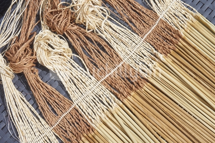 Closeup of tanekaha dyed muka strands with pokinikini - Maori flax weaving with muka fibre
