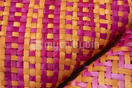 Flax weaving (raranga harakeke) - close up of two kete (bags)