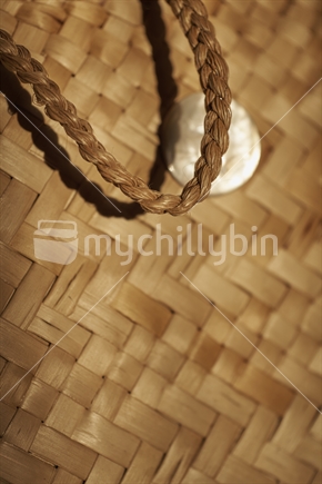 Close up of a kete (bag) with handle - Maori flax weaving (raranga harakeke)