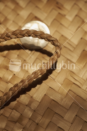 Closeup of a natural kete and handle - Maori flax weaving (raranga harakeke)