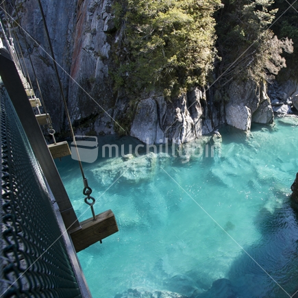 Looking down from the bridge at the Blue Pools in Haast, West Coast