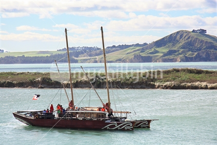 Maori Twin Hulled Waka seen in the Karitane estuary, Otago.