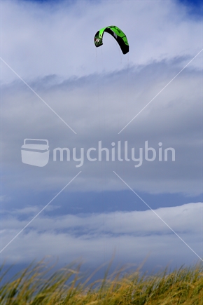 A kite flies high in a good breeze at Tahunanui Beach.