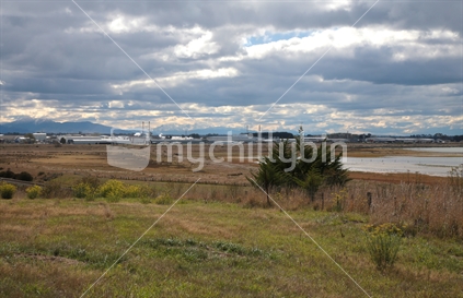 Looking north from coastal south Timaru, industrial area in the distance.