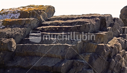 Here the pattern of the basalt rock takes the shape of a stairway at Karitane Beach, near Dunedin.