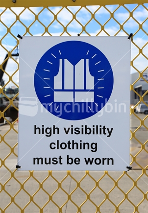 Sign warns that high visibility clothing must be worn when in the area.