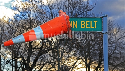 Cone on road Town Belt sign.