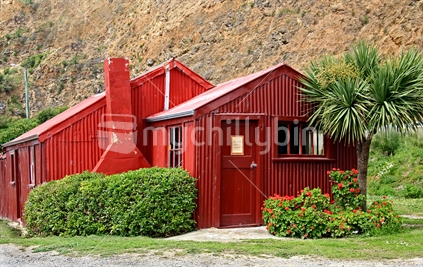 Twin red sheds at the harbour's edge in Oamaru are attractively maintained and part of the tourist scene.