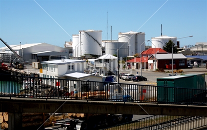 Busy Port Timaru scene with many storage tanks.