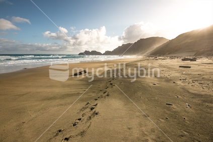 Footprints on an empty beach