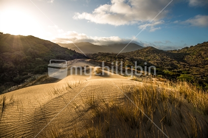 Hiking over sand dunes, Stewart Island
