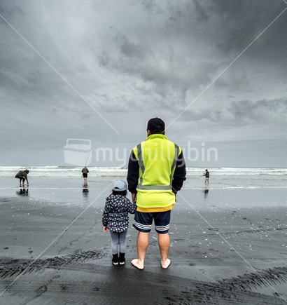 Man And Child Watching Fishing