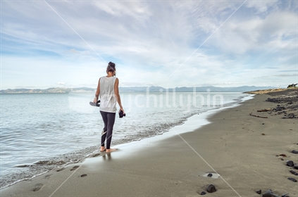 Lady Walking On Beach