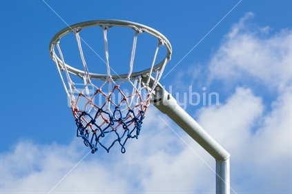 Netball hoop against blue sky