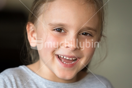 Pretty smiling happy little girl closeup