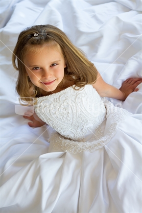 Pretty little girl wearing wedding dress