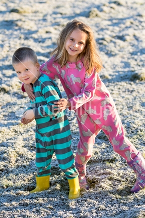 Two children playing in the frost