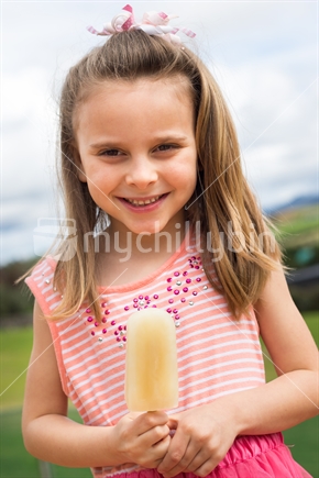 Pretty girl holding lemonade ice block
