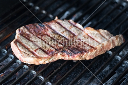Beef Steak cooking on the barbeque