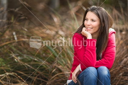Beautiful woman in grassy bush