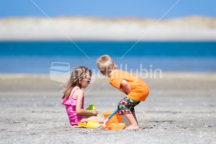 Kids playing in sand at the beach