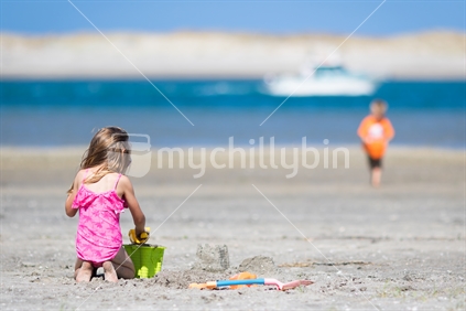 Kids playing in the sand at beach