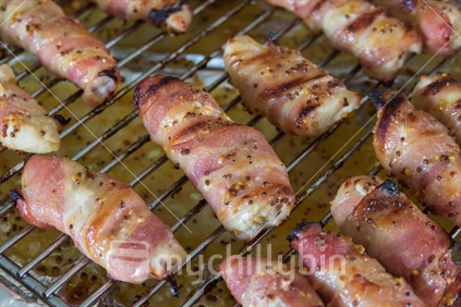 Bacon wrapped chicken on the grill