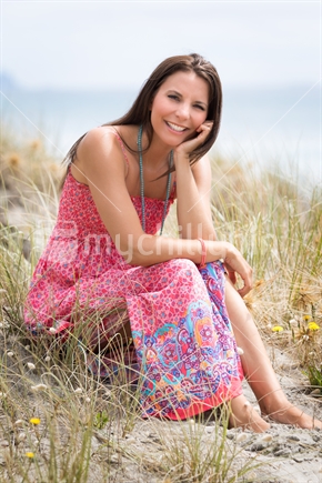 Beautiful smiling woman on the beach