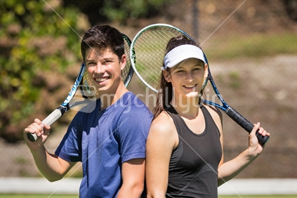 Boy and girl playing tennis