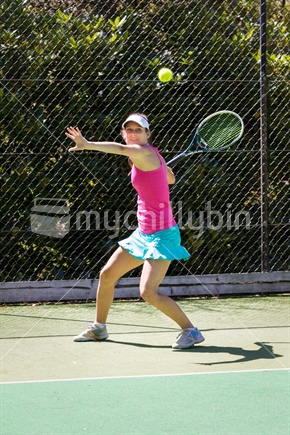 Pretty girl playing tennis