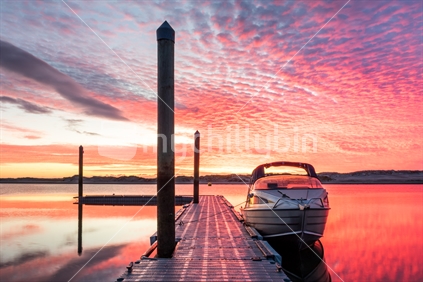 Boat and jetty sunrise