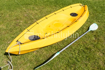 Yellow kayak with paddle
