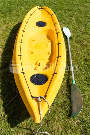 Yellow kayak with paddle