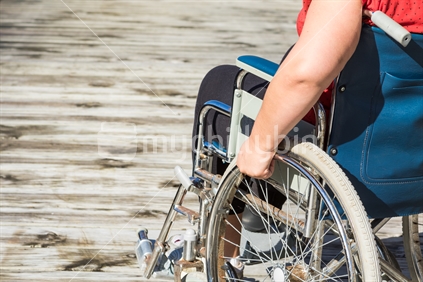 Woman in self propelled wheelchair