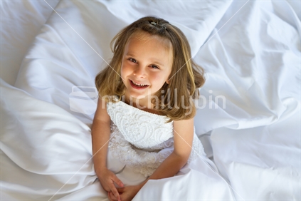 Little girl wearing wedding dress