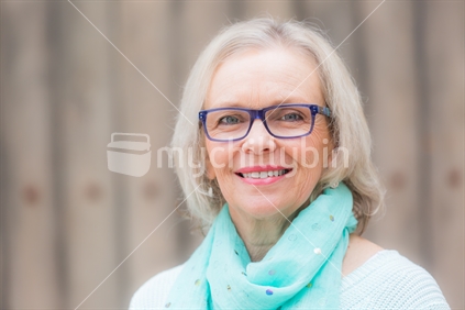 A headshot of a good looking blonde woman
