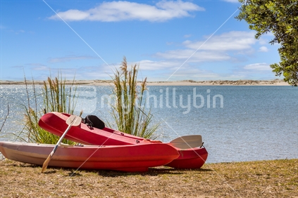 Kayaks on Mangawhai estuary shore