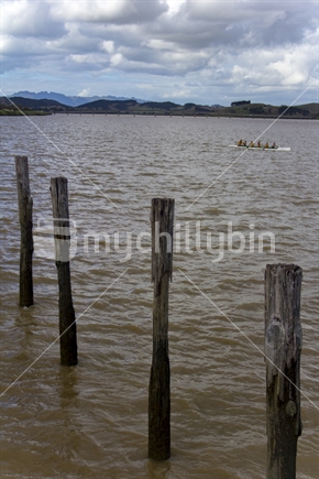 Pier Posts and Rowing Skiff