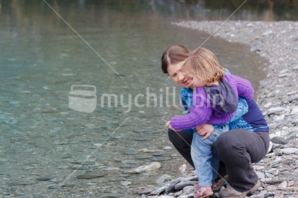 Mother and daughter by the river.