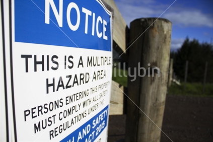 Hazard sign on a farm gate