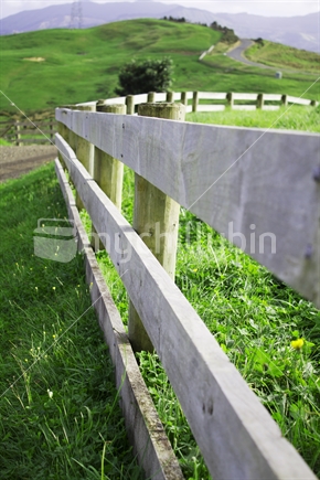 Wooden fence leading up the hill 