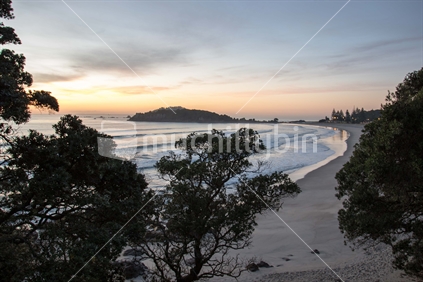 Sunrise looking out from Mt Maunganui across Maunganui Beach towards Moturiki Island (Leisure Island)